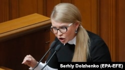 Yulia Tymoshenko, Ukraine's former prime minister, received a settlement from a U.S. law firm to avoid a suit, The New York Times reported. (file photo)