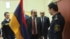 While touring a customs facility in Yerevan on April 9, Pashinian noticed a dirty Armenian flag in an office. Already upset with a customs officer for failing to stand at attention when he entered the room, Pashinian reacted swiftly, ordering everyone in 