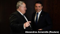 Greek Foreign Minister Nikos Kotzias (left) and his Macedonian counterpart, Nikola Dimitrov, talk during a meeting in Thessaloniki, Greece, on May 4.