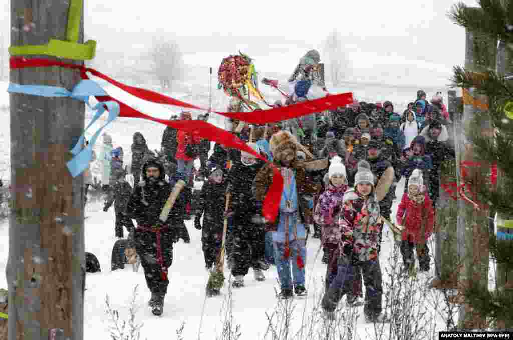 People carry a figure representing Lady Maslenitsa during the Maslenitsa festival outside St. Petersburg on March 1. The Maslenitsa festival, which originates from Slavic mythology, took place this year from February 24 to March 1.