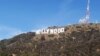 U.S. -- The freshly painted Hollywood sign is seen atop the Hollywood Hills following a press conference to announce the completion of the famous landmark's major makeover in Hollywood, California, 04Dec2012 