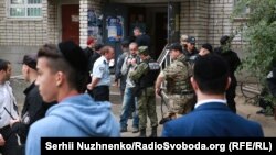 Police officers near the scene of the explosion in Uman on September 21