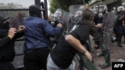 Greek protesters clashed with riot police protecting the Greek Parliament in Athens on October 9.