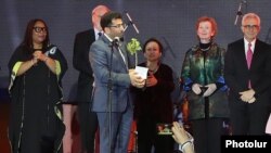Armenia -- Yazidi activist Mirza Dinnayi receives the 2019 Aurora Prize for Awakening Humanity at a ceremony in Yerevan, October 19, 2019.
