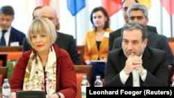 Iranian top nuclear negotiator Abbas Araqchi (R) and Helga Schmit , Secretary-General of the European External Action Service (EEAS), attend a meeting of the JCPOA Joint Commission in Vienna, June 28, 2019