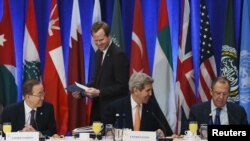 U.S. Secretary of State John Kerry (center) talks to Russian Foreign Minister Sergei Lavrov (right) ahead of their meeting on Syria at United Nations headquarters in New York as UN Secretary-General Ban ki-Moon (left) looks on. 