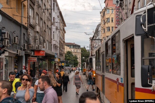 People exit a tram in downtown Sofia.