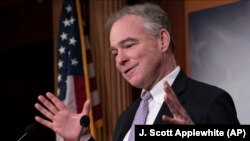 Sen. Tim Kaine, D-Va., speaks to reporters just after the Senate voted to approve the bipartisan measure limiting President Donald Trump's authority to launch military operations against Iran. February 13, 2020