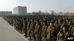 Newly-graduated Afghan National Army (ANA) cadets attend during their graduation ceremony at the Afghan Kabul Military training centre (KMTC) in Kabul on December 30. 