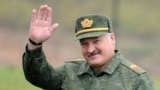 BELARUS -- Belarus' President Alexander Lukashenko waves as he arrives to inspect the joint Russian-Belarusian military exercises Zapad-2017 (West-2017) at a training ground near the town of Borisov on September 20, 2017.