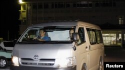 A van carrying Zhan Qixiong, the captain of a Chinese fishing boat, leaves from Ishigaki police station on the southern Japanese island of Ishigaki on September 25.