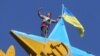 Four Russians Under House Arrest For Ukrainian Flag Stunt