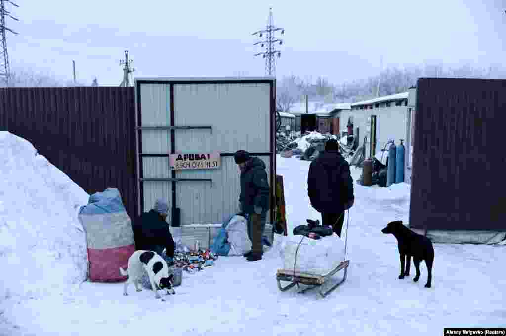 Vergunov and Andrei, nicknamed &quot;Prizrachnyy Gonshchik&quot; (Ghost Rider), organize aluminum cans that they brought to a recycling center for money.