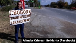A Crimean Tatar man carries out a single-person protest against Russia's occupation of Crimea on October 14.