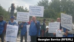 A demonstration by metal workers in Kutaisi is broken up on September 16.