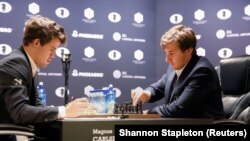 Magnus Carlsen (left) faces Sergei Karjakin in the World Chess Championship final in New York City on November 30.