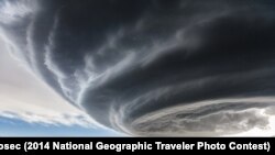 Grand Prize: "The Independence Day" by Marko Korošec. Julesburg, Colorado, United States. "While on storm chasing expeditions in the Tornado Alley in USA I have encountered many photogenic supercell storms. This photograph was taken while we were approaching the storm near Julesburg, Colorado on My 28th, 2013. The storm was tornado warned for more than one hour, but stayed an LP storm through all its cycles and never produced a tornado, just occasional brief funnels, large hail and some rain."<br />
