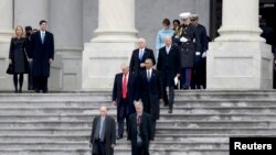 U.S. President Donald Trump escorts former President Barack Obama from the U.S. Capitol with Vice President Mike Pence and former Vice President Joe Biden.