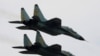FILE PHOTO: Russian-made Sukhoi fighter jets of the Iranian army fly past during a military parade to commemorate army day in Tehran April 17, 2008.