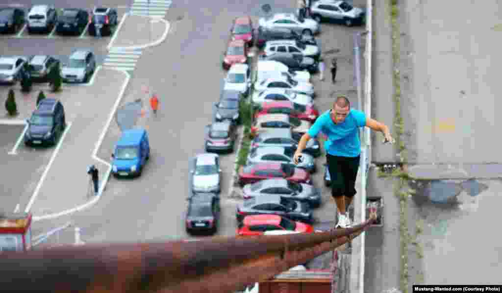 Walking on the steel cables of a bridge