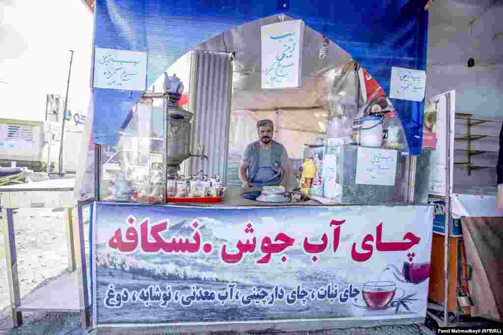 Yusif Şahram, 47, is a tea house owner in the Sahili Bazaar. He serves candy with each glass of tea.