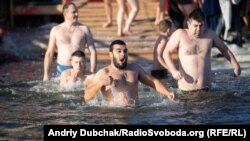 Ukrainians take part in Epiphany celebrations in Kyiv on January 19. 