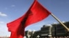 A Kosovar Albanian waves the Albanian flag during a protest against deployment of the EU mission in Pristina ealier this month.