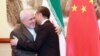 Chinese Foreign Minister Wang Yi (right) greets Iranian Foreign Minister Mohammad Javad Zarif at the Diaoyutai State Guesthouse in Beijing on August 26, 2019.