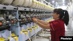 Armenia -- A worker at a newly refuribished textile factory in Maralik, August 10, 2019.