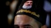 LEBANOn -- A Lebanese Shiite supporter of the Iranian-backed Hizballah group, with a portrait on his head of Hizballah leader Sayyed Hassan Nasrallah, attends an activities to mark the ninth of Ashura, a 10-day ritual commemorating the death of Imam Husse