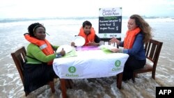 Performans aktivista Oxfama o klimatskim promjenama u Durbanu, Južnoafrička Republika, fotoarhiv
