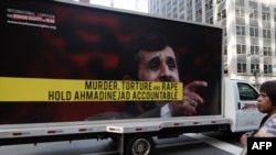 A truck displaying posters protesting against Iranian President Mahmud Ahmadinejad near the UN building in New York in September 2009 