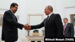 Russian Preident Vladimir Putin (right) meets with Venezuelan President Nicolas Maduro at the Kremlin in Moscow on October 3. 