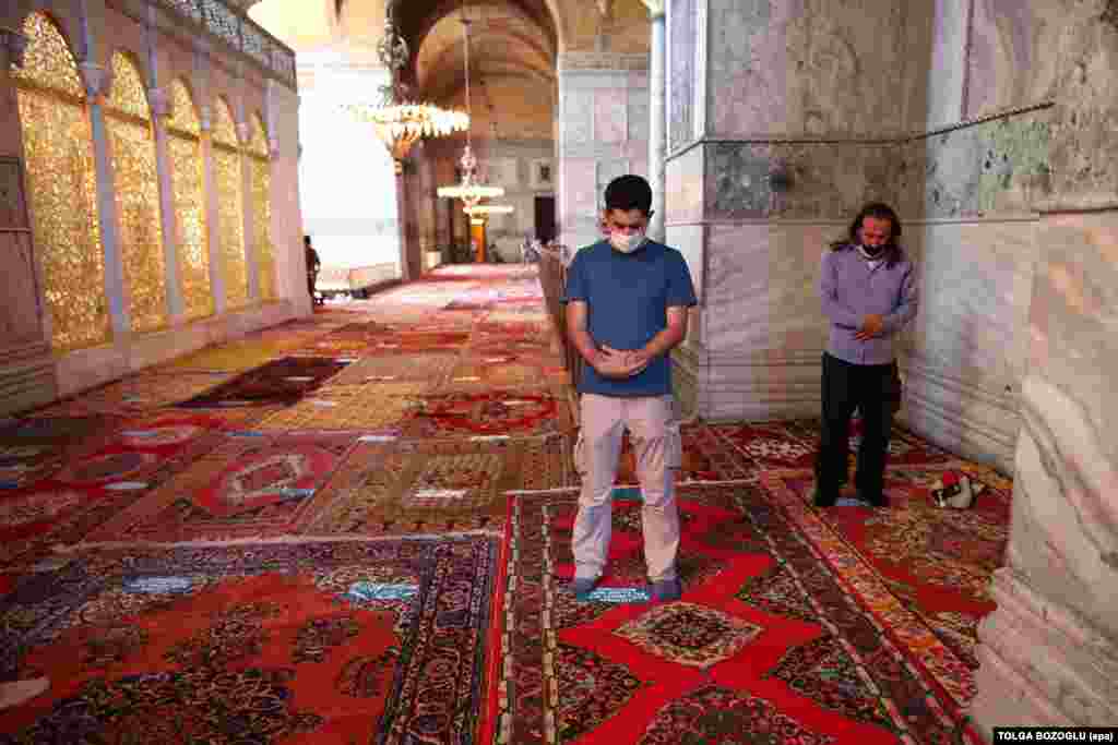 Men praying inside Hagia Sophia on July 24. Greece's culture minister called the reconversion of the iconic building "an open provocation to the entire civilized world."