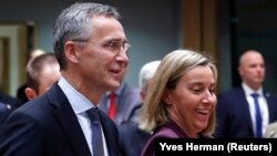 NATO Secretary-General Jens Stoltenberg (left) and European Union foreign policy Chief Federica Mogherini (file photo)