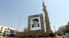 A Shahab-3 surface-to-surface missile, which is said to be capable of delivering a long-range nuclear warhead, is displayed next to a portrait of Iranian Supreme Leader Ayatollah Ali Khamenei at a street exhibition in Tehran earlier this year. 