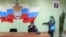 Орусиянын полиция бөлүмүндөгү мигрант аял