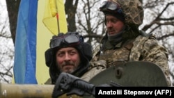 Украинские военнослужащие в зоне боевых действий в Харьковской области. Фото прессслужбы Сухопутных войск Украины, обнародованное 19 апреля 2022 года.