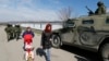 Российский бронеавтомобиль "Тигр" возле украинской воинской части в Перевальном. 14 марта 2014 года