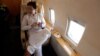 PAKISTAN -- Imran Khan, chairman of the Pakistan Tehreek-e-Insaf (PTI), political party, holds his tasbih, while having tea on a plane on his way to a campaign rally ahead of general elections in Sialkot, Pakistan July 12, 2018Reuters