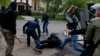 Pro-Russian militants attack a pro-Ukranian protester during a pro-Ukraine rally in the eastern city of Donetsk on April 28. 