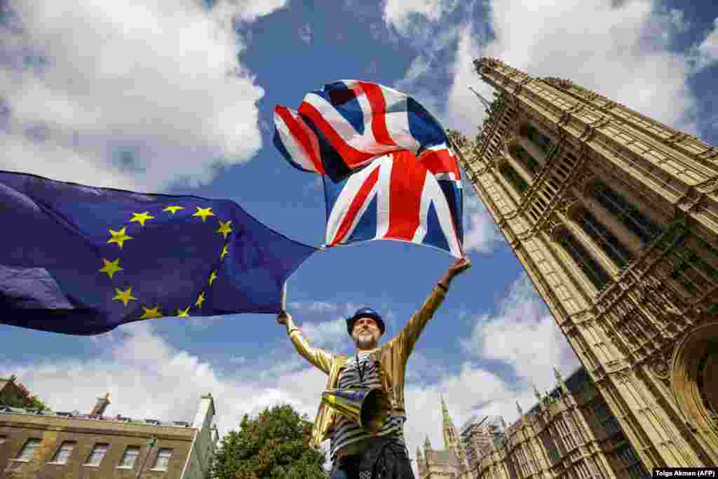A pro-European Union demonstrator protests outside Parliament in central London against the first vote on a bill to end Britain's membership in the EU. (AFP/Tolga Akmen)