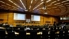 International Atomic Energy Agency (IAEA) Director General Rafael Grossi waits for the start of an interactive board of governors meeting in an nearly empty meeting room at the IAEA headquarters amid the coronavirus pandemic. June 15, 2020