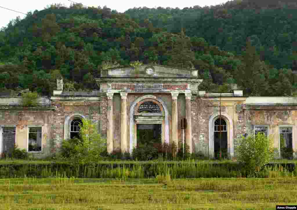 Near Gali, grass blankets the railway tracks in front of Tkvarcheli&#39;s abandoned train station.