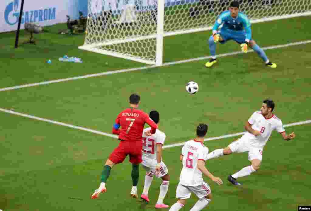 Soccer Football - World Cup - Group B - Iran vs Portugal - Mordovia Arena, Saransk, Russia - June 25, 2018 Portugal's Cristiano Ronaldo shoots at goal REUTERS/Lucy Nicholson