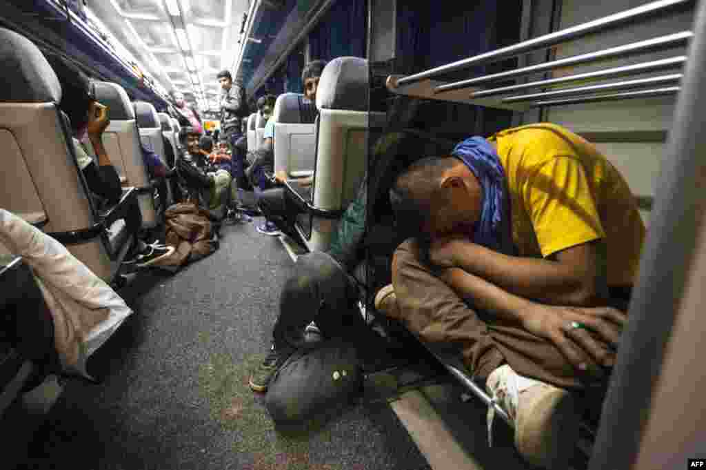 Migrants travel on a train bound for the northern Serbian city of Subotica, near the border with Hungary. (AFP/Igor Pavicevic)