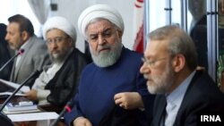 Head of Iran's Judiciary, Sadegh Larijani (left), Iranian President Hassan Rouhani, and Speaker of Parliament Ali Larijani. August 14, 2018.