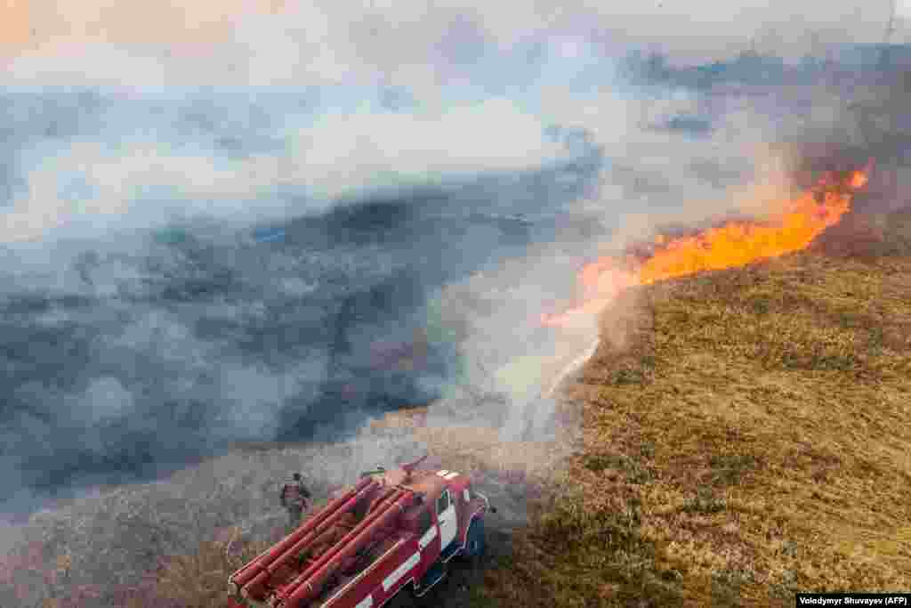 Nearly 100 firefighting vehicles were being used to battle the wildfires.