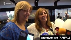 Armenia - Nora Abusefian (R), a Syrian Armenian from Aleppo, speaks to reporters at Yerevan airport, 28Jun2017.