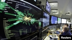 A graphic showing a collision at full power in the control room for the Large Hadron Collider (LHC) at the European Organization for Nuclear Research (CERN). In 2012, CERN announced it may have discovered the elusive Higgs boson particle. (file photo)